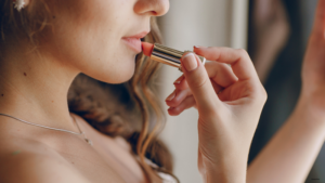 woman using lipstick