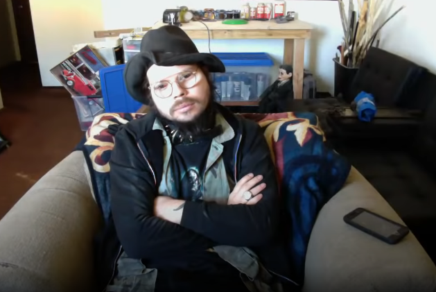 KingCobraJFS, sitting in an armchair 