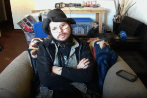 KingCobraJFS, sitting in an armchair